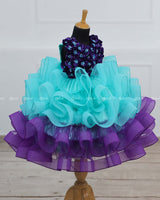 Aqua Blue And Purple Gown with Fluffy Layered Netted Bottom And Hand-Crafted Purple Flowers