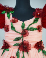 Maroon and peach double shade couturegown with frilled sleeves and handcrafted flowers and leaves