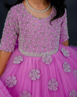 Pink lavender twirled gown with crystal and bead detailing