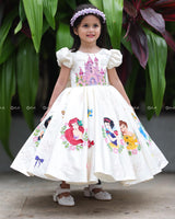 Enchanting frock featuring princesses and a fairytale castle—perfect for a magical occasion.