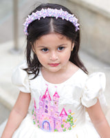 Enchanting frock featuring princesses and a fairytale castle—perfect for a magical occasion.