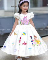 Enchanting frock featuring princesses and a fairytale castle—perfect for a magical occasion.