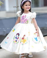 Enchanting frock featuring princesses and a fairytale castle—perfect for a magical occasion.