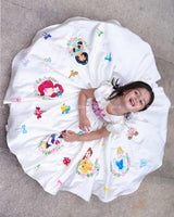 Enchanting frock featuring princesses and a fairytale castle—perfect for a magical occasion.