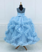 Elegant Sky Blue Ball Gown With Ruffle Detailing And Diamond Belt.