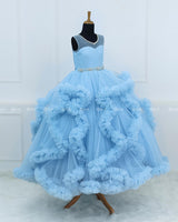 Elegant Sky Blue Ball Gown With Ruffle Detailing And Diamond Belt.