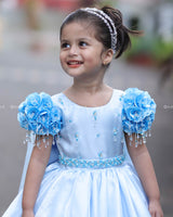 Dreamy Sky Blue Gown With Floral Puff Sleeves Adorned With Crystal Hangings, Handworked Belt And Long Veil.