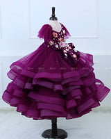 Plum Purple twirled gown with multicolored pastel flower embellished yoke and hand crafted bow