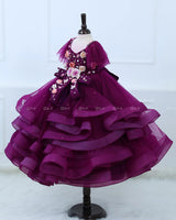 Plum Purple twirled gown with multicolored pastel flower embellished yoke and hand crafted bow
