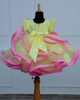 Pale Yellow Twirled Gown with Pink and Greenish Blue Hand-Crafted Flower and Detailing