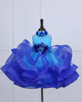 Baby Blue halter neck twirled couture gown with royal blue flowers embellishments.