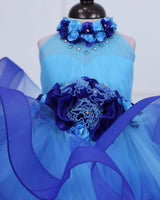 Baby Blue halter neck twirled couture gown with royal blue flowers embellishments.