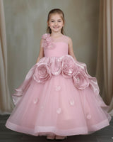 Pastel-pink gown with 3D flowers and soft tulle layers.
