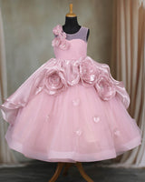 Pastel-pink gown with 3D flowers and soft tulle layers.