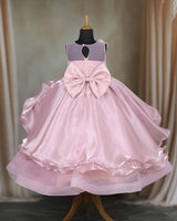 Pastel-pink gown with 3D flowers and soft tulle layers.