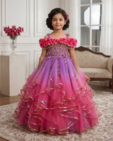 A Dreamy Cold-Shoulder Ball Gown with Flowing Layers of Lavender and Pink Tulle.