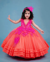 coral and fuchsia pink party wear gown with heavy and crafted yoke and petal detailing