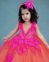 coral and fuchsia pink party wear gown with heavy and crafted yoke and petal detailing