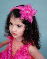 coral and fuchsia pink party wear gown with heavy and crafted yoke and petal detailing