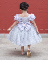 Misty Grey Feather Frock With Heavy Handworked Yoke And Draped Sleeve With Hanging Tassels