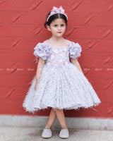 Misty Grey Feather Frock With Heavy Handworked Yoke And Draped Sleeve With Hanging Tassels