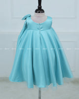 Sleeveless Aqua Frock With A Pearl-Detailed Bow And Flared Hem