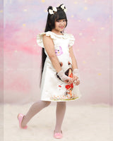Cream Peter Pan Collar Dress With Cartoon Print And Frilled Sleeves.