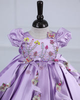 Butterfly and Floral Theme Lavender Frock with Attached Bows in waistline and Applique Works.