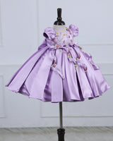 Butterfly and Floral Theme Lavender Frock with Attached Bows in waistline and Applique Works.