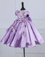 Butterfly and Floral Theme Lavender Frock with Attached Bows in waistline and Applique Works.