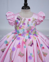 Baby pink floral frock with puff sleeves and handworked butterfly with bow