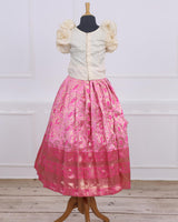 Pink brocade skirt with creme ruffled handcrafted top pattupavada set