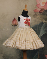 Ivory Frock With Printed Red Roses On The Yoke, Pearl Embellishments And A Pleated Striped Flare