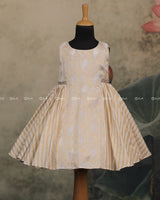 Ivory Frock With Brocade Bodice, Embellished Waist Highlights And Pleated Striped Flare