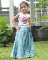 Sleeveless Pink Top With Floral Print And Pearls, Paired With Pleated Blue Brocade Skirt And Golden Lace Hem