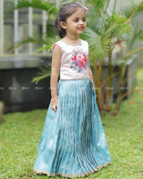 Sleeveless Pink Top With Floral Print And Pearls, Paired With Pleated Blue Brocade Skirt And Golden Lace Hem