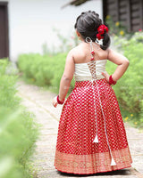Floral Halter Top With Pearl Detailing, Paired With Red Brocade Skirt
