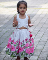 White Crop Top Pearl Beads Paired With A Flared Skirt Featuring Vibrant Pink Floral Embroidery