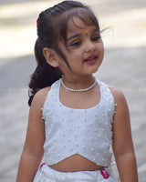 White Crop Top Pearl Beads Paired With A Flared Skirt Featuring Vibrant Pink Floral Embroidery