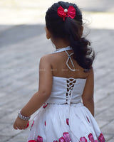 White Crop Top Pearl Beads Paired With A Flared Skirt Featuring Vibrant Pink Floral Embroidery