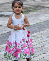 White Crop Top Pearl Beads Paired With A Flared Skirt Featuring Vibrant Pink Floral Embroidery