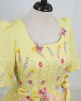 Butterfly and Floral Theme Yellow Gown with Attached Bows and Applique Works