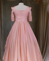 Butterfly and Floral Theme Peach Gown with Attached Bows and Applique Works.