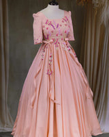 Butterfly and Floral Theme Peach Gown with Attached Bows and Applique Works.