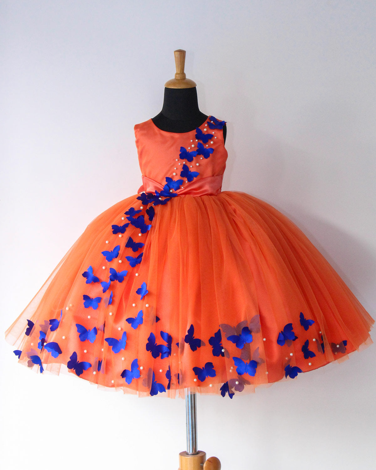Tangerine Orange Frock With Spreaded Blue Butterflies Online Tamil