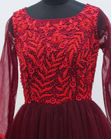 Red and maroon ombre shaded designer gown with applique flowers and bead work