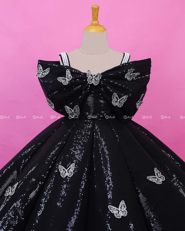 Black Sequence Panel Gown Highlighted with Handcrafted Silver Butterfly Patches.