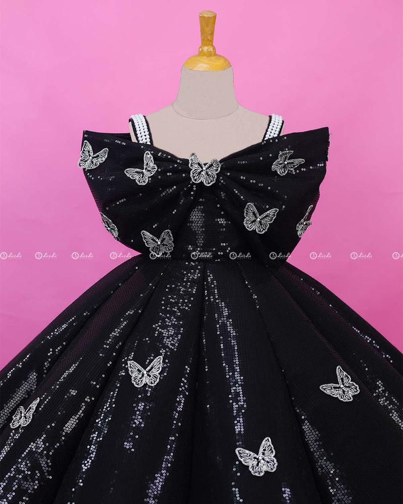 Black Sequence Panel Gown Highlighted with Handcrafted Silver Butterfly Patches.