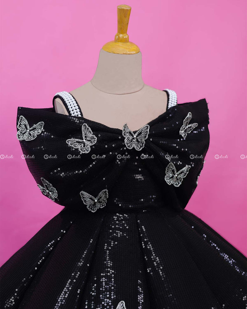 Black Sequence Panel Gown Highlighted with Handcrafted Silver Butterfly Patches.