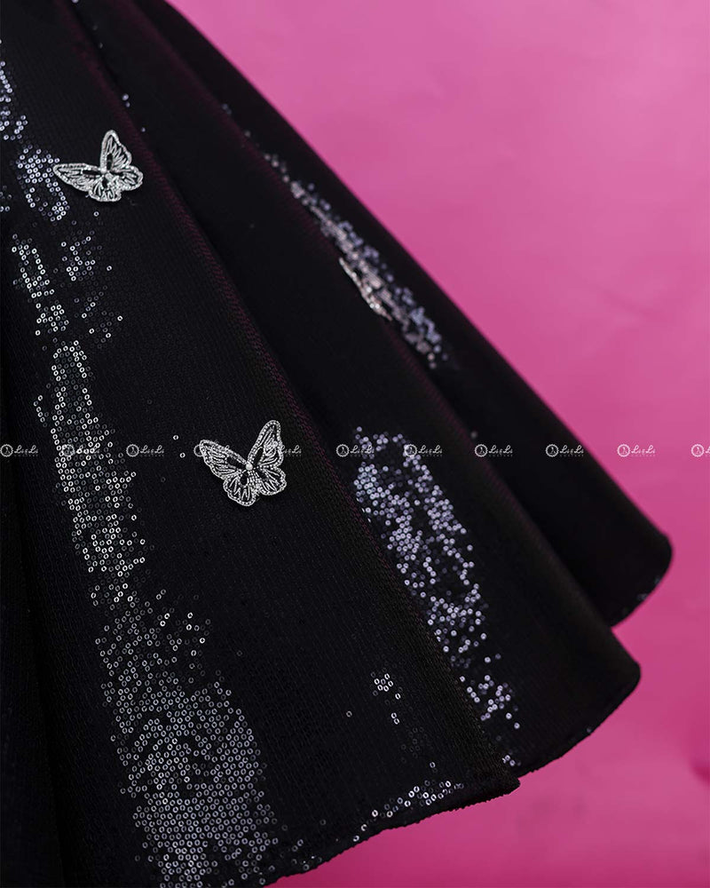 Black Sequence Panel Gown Highlighted with Handcrafted Silver Butterfly Patches.